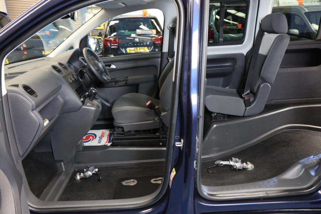 VW Caddy passenger wheelchair upfront